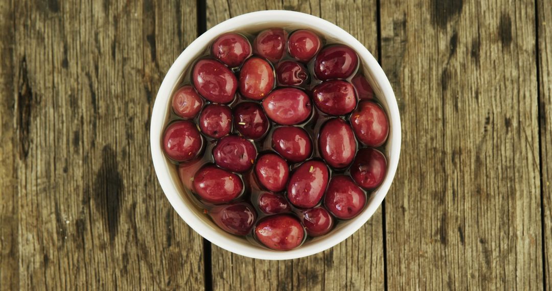 Fresh Cranberries in a Bowl on Rustic Wooden Surface - Free Images, Stock Photos and Pictures on Pikwizard.com