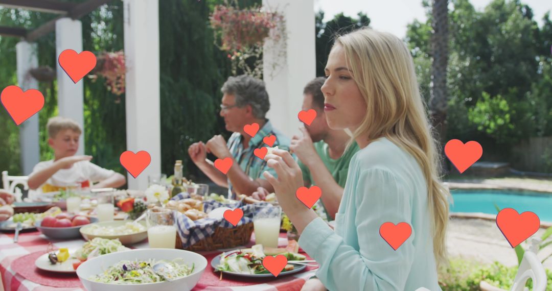 Family Gathering in Garden with Floating Hearts Overlay