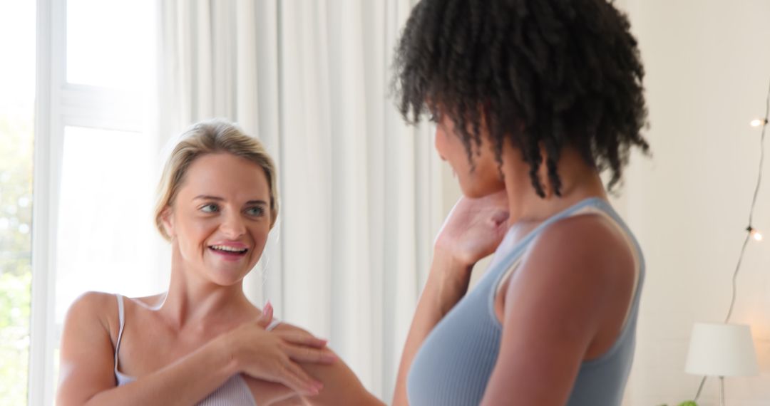 Diverse Friends Enjoying a Stretch Session in Sunlit Room