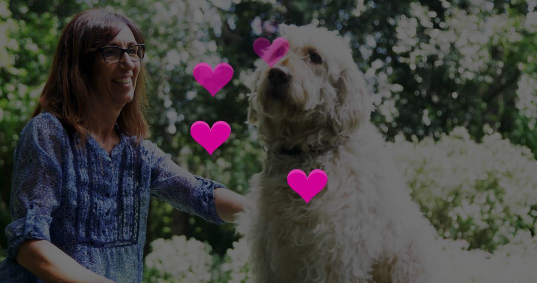 Smiling Woman Petting Dog in Sunlit Forest - Free Images, Stock Photos and Pictures on Pikwizard.com