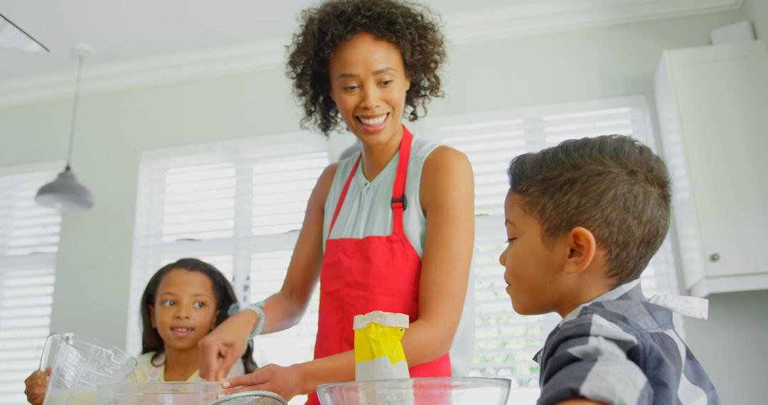 Mother Cooking with Kids in Bright Home Kitchen