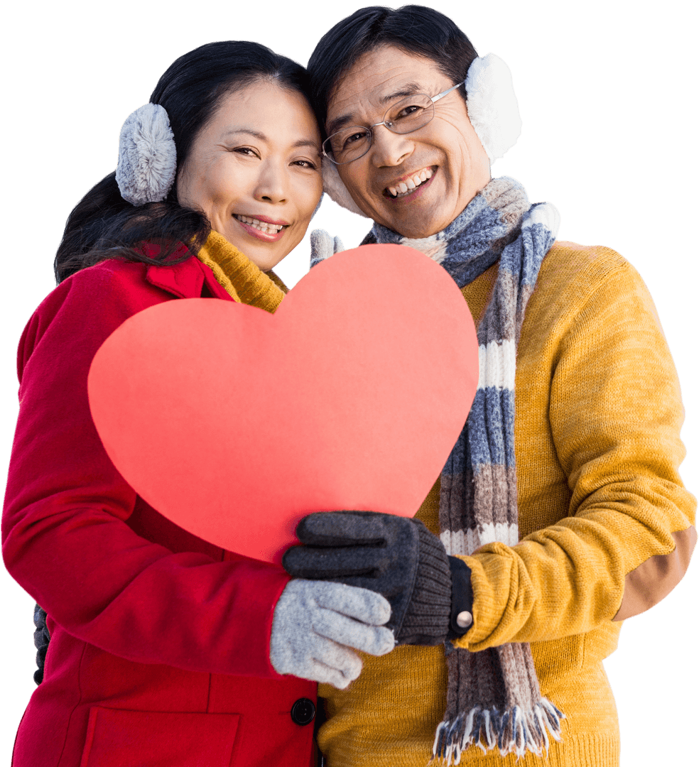Happy Asian Couple Displaying Red Heart On Cold Winter Day