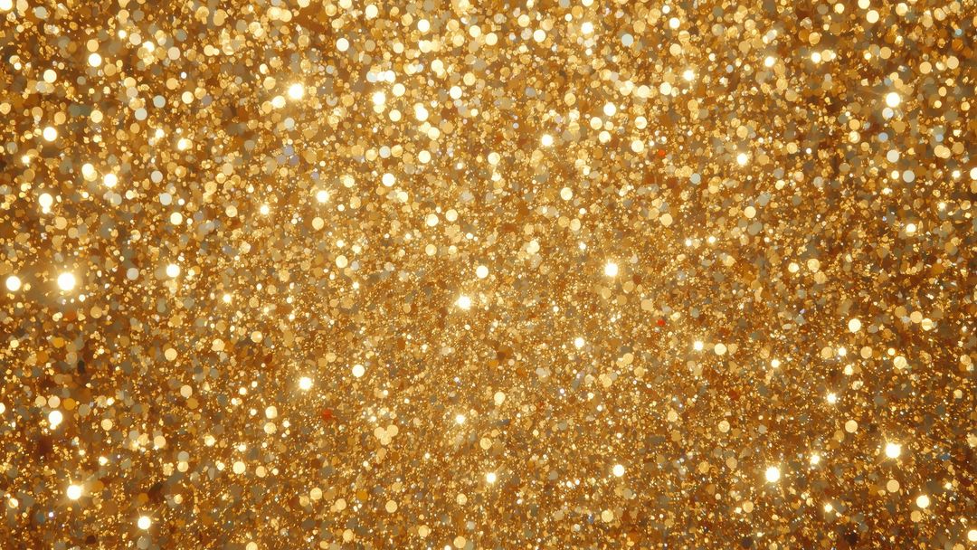 Glittering Gold Particles on Sparkling Abstract Background