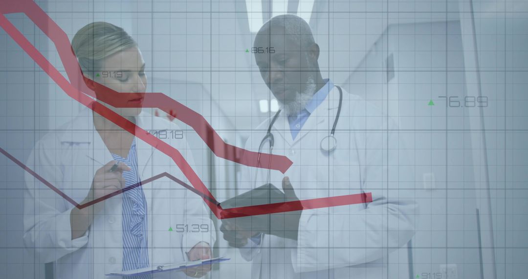 Doctors Analyzing Data with Technology in Hospital Corridor