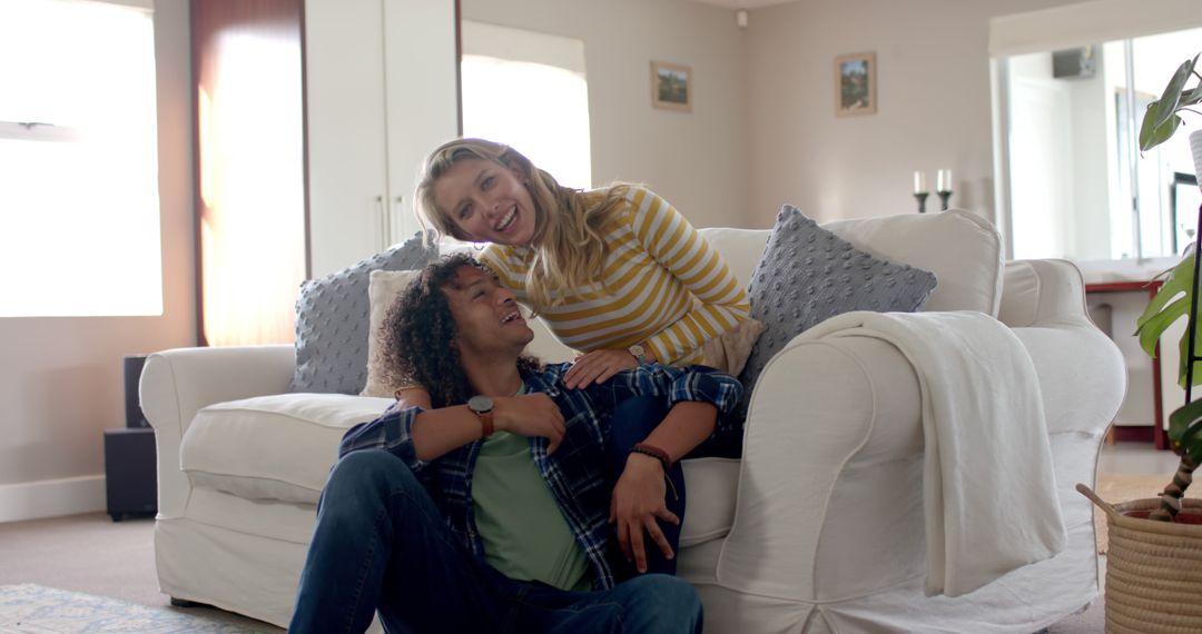 Cheerful Embracing Couple Relaxing Together at Home