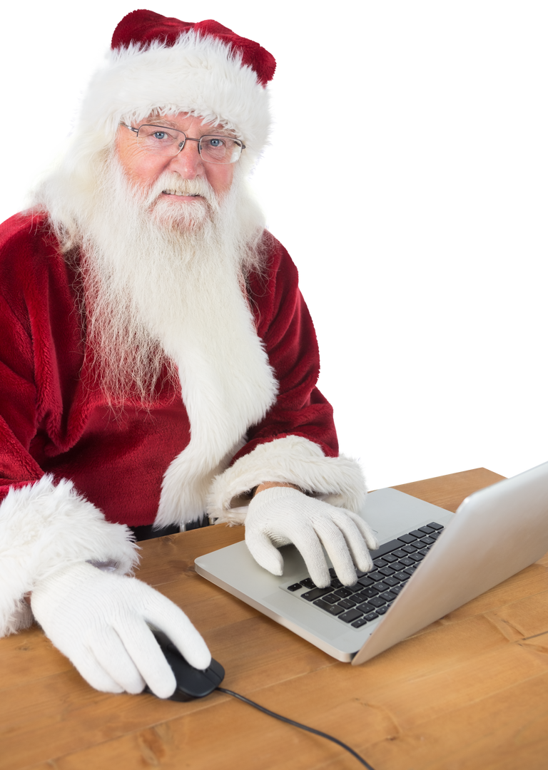 Transparent Santa Claus Using Laptop at Wooden Desk - Download Free Stock Images Pikwizard.com