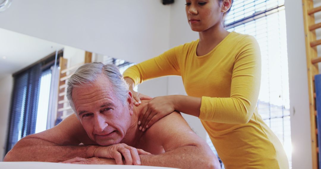 Professional Massage Therapy for Senior Gentleman with Relaxing Atmosphere - Free Images, Stock Photos and Pictures on Pikwizard.com