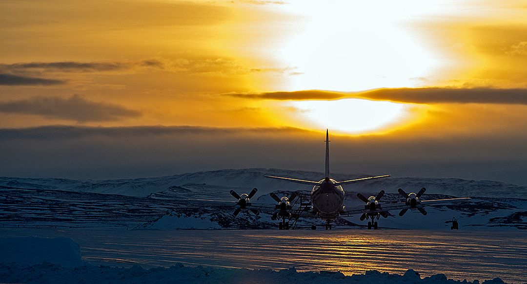 P-3B Aircraft at Thule Air Base During Sunrise, Greenland - Free Images, Stock Photos and Pictures on Pikwizard.com