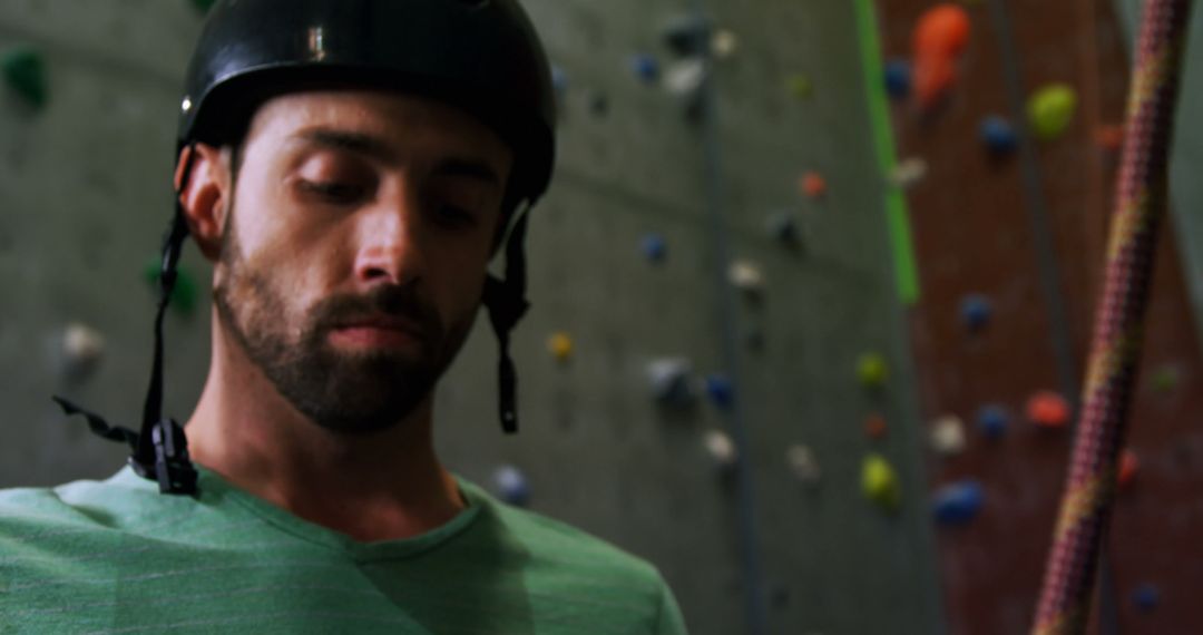 Male Climber Focusing While Rock Climbing Indoors - Free Images, Stock Photos and Pictures on Pikwizard.com