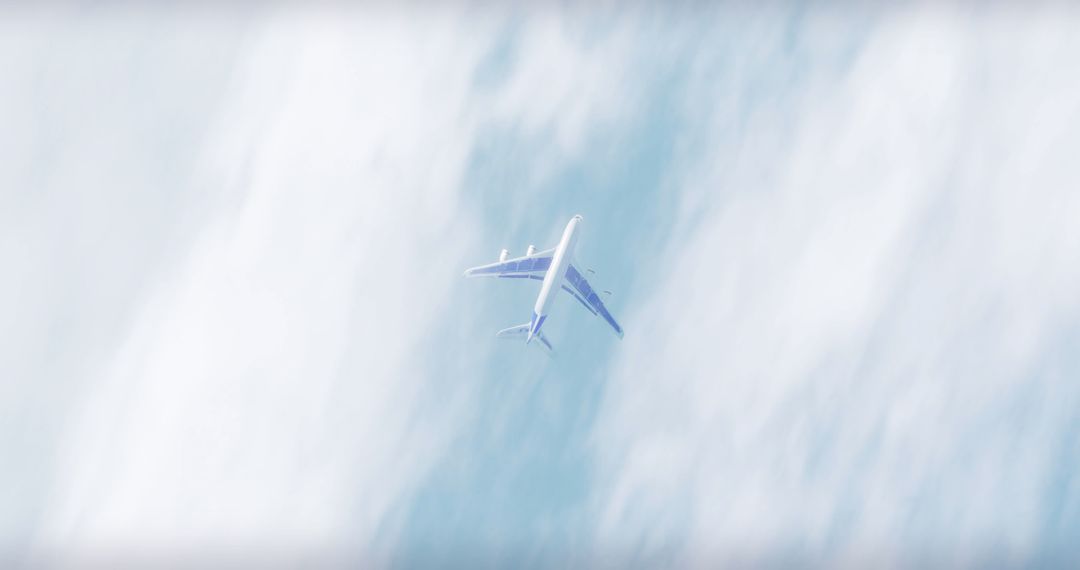 Airplane Flying Above Cloudscape in Blue Skies