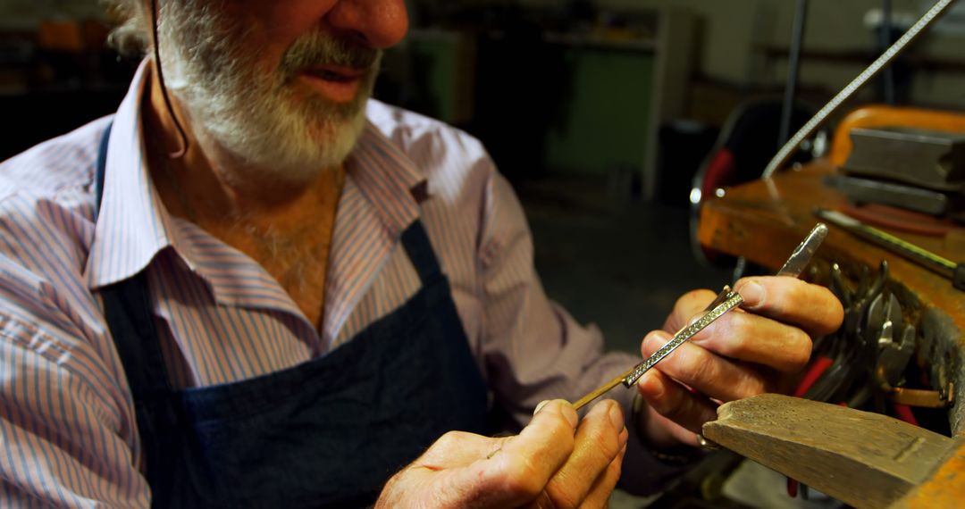 Elderly Male Jeweler Crafting Silver Jewelry in Workshop - Free Images, Stock Photos and Pictures on Pikwizard.com