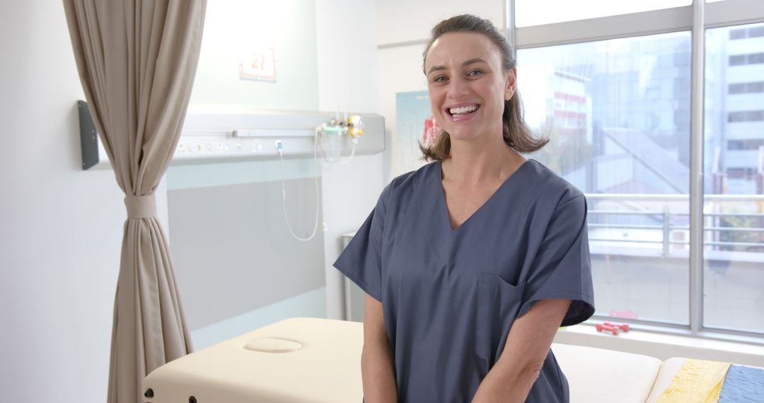 Smiling Nurse Standing in Hospital Room with Large Window - Free Images, Stock Photos and Pictures on Pikwizard.com