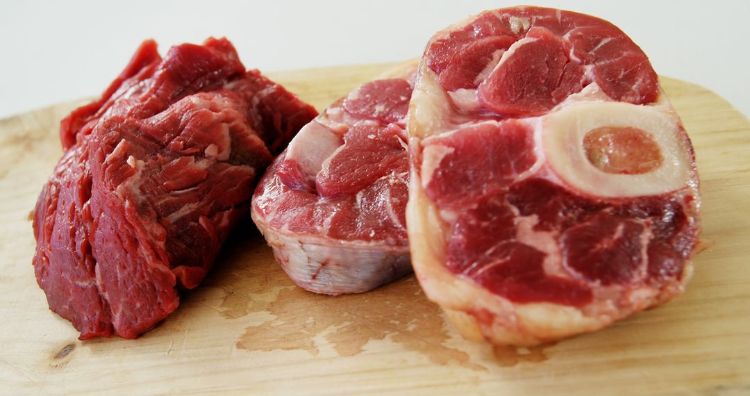 Assorted Raw Beef Cuts on Wooden Cutting Board - Free Images, Stock Photos and Pictures on Pikwizard.com