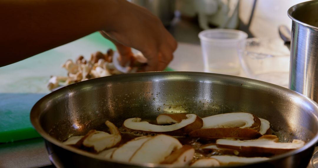 Chef Sautéing Fresh Mushrooms in Kitchen for Home Cooking - Free Images, Stock Photos and Pictures on Pikwizard.com