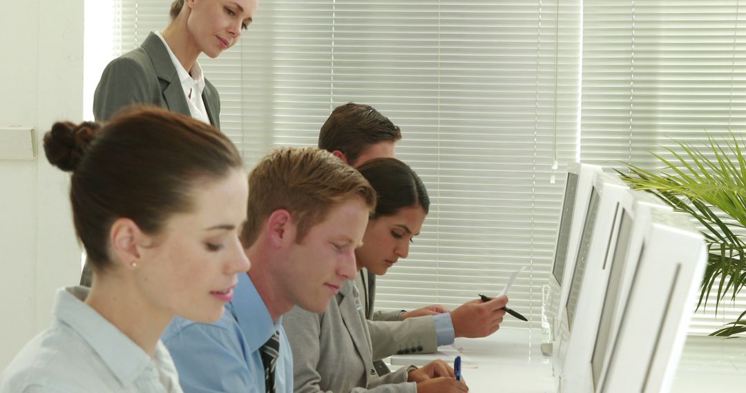 Office Workers in Training Session Using Computers - Free Images, Stock Photos and Pictures on Pikwizard.com