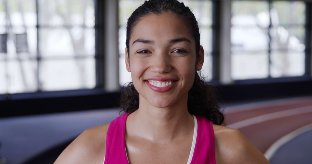 Smiling Athlete in Gym, Confident Young Woman in Sportswear - Free Images, Stock Photos and Pictures on Pikwizard.com