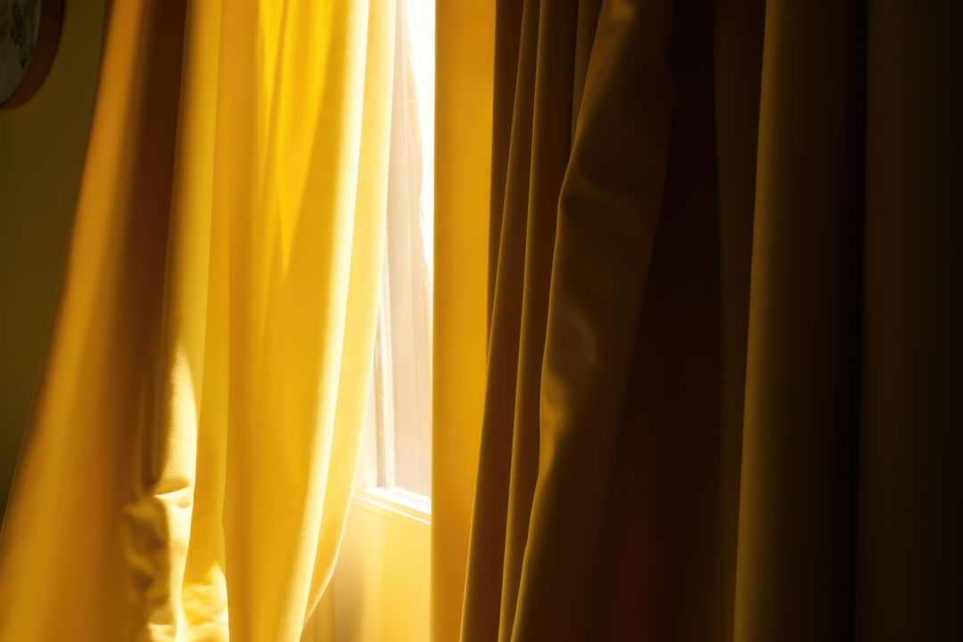 Yellow curtains hanging in room with window, created using generative ai technology - Free Images, Stock Photos and Pictures on Pikwizard.com