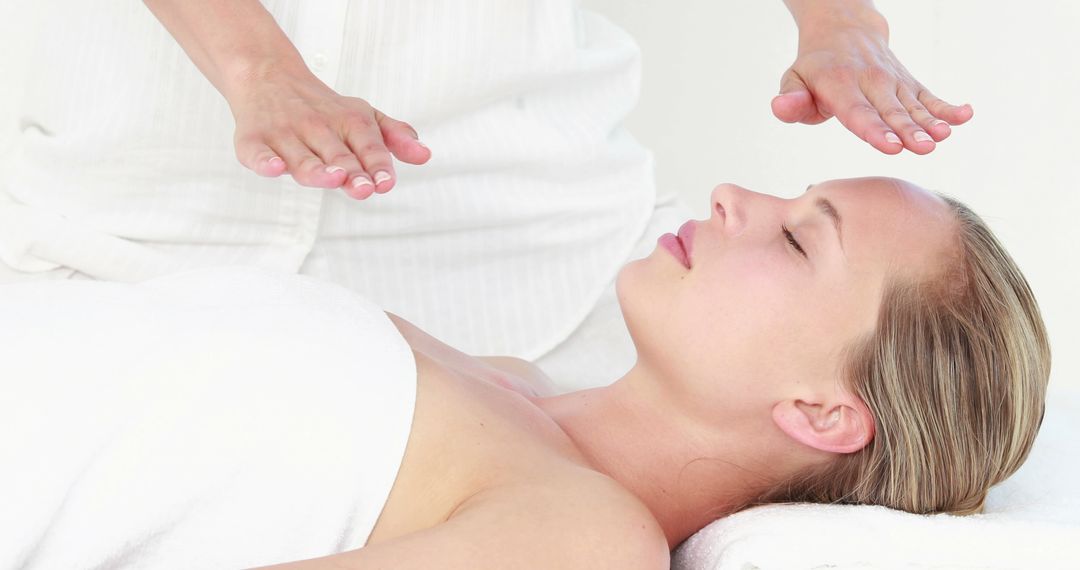 Woman Receiving Reiki Healing Therapy in Spa - Free Images, Stock Photos and Pictures on Pikwizard.com