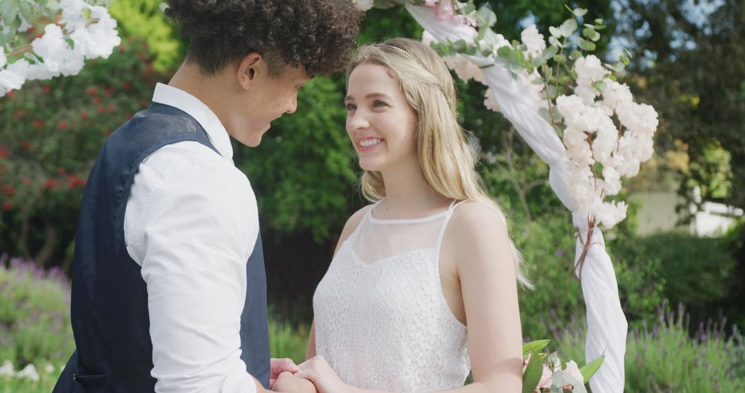 Smiling Couple Embrace Outdoors on Wedding Day