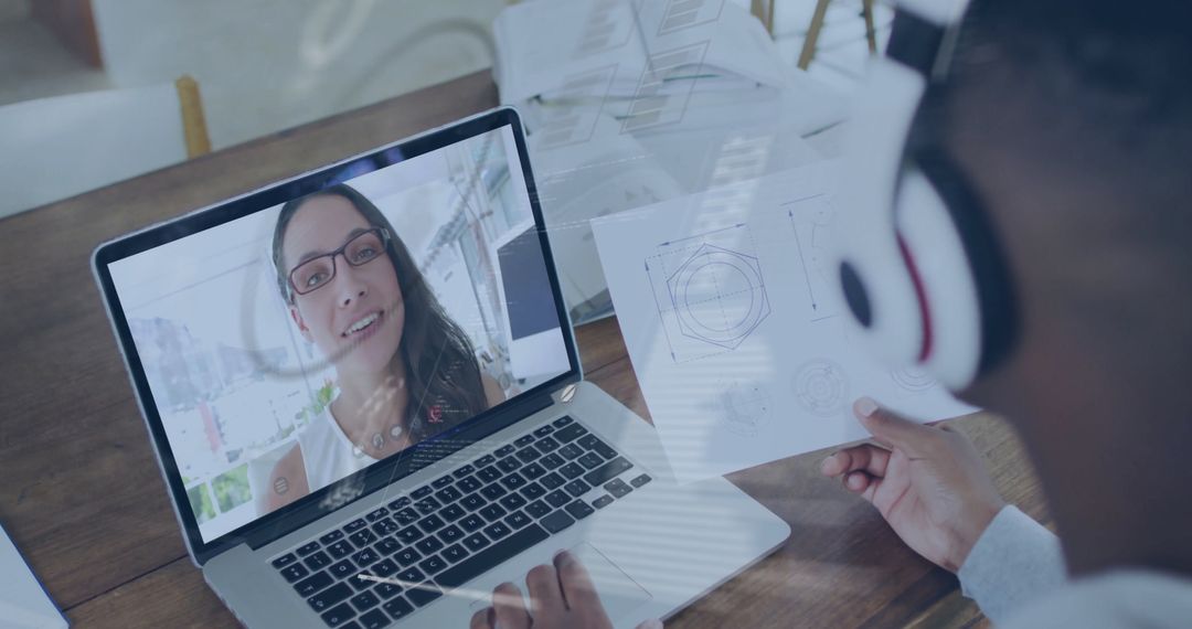Engineer Participating in Virtual Meeting Reviewing Technical Diagrams