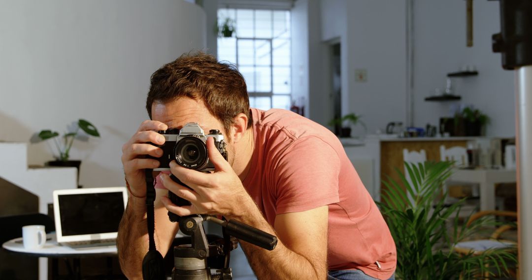 Man Taking Photo in Modern Home Studio - Free Images, Stock Photos and Pictures on Pikwizard.com