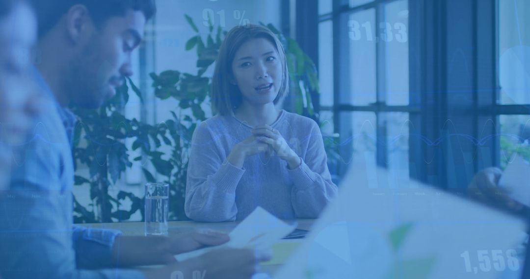 Diverse Business Team Discussing Financial Report in Modern Office