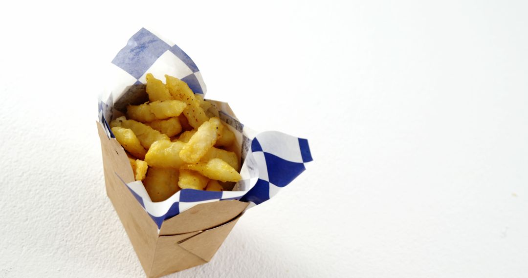 French Fries in Takeout Container on White Background - Free Images, Stock Photos and Pictures on Pikwizard.com