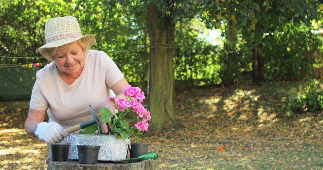 Senior Woman Gardening Outside on a Sunny Day - Free Images, Stock Photos and Pictures on Pikwizard.com