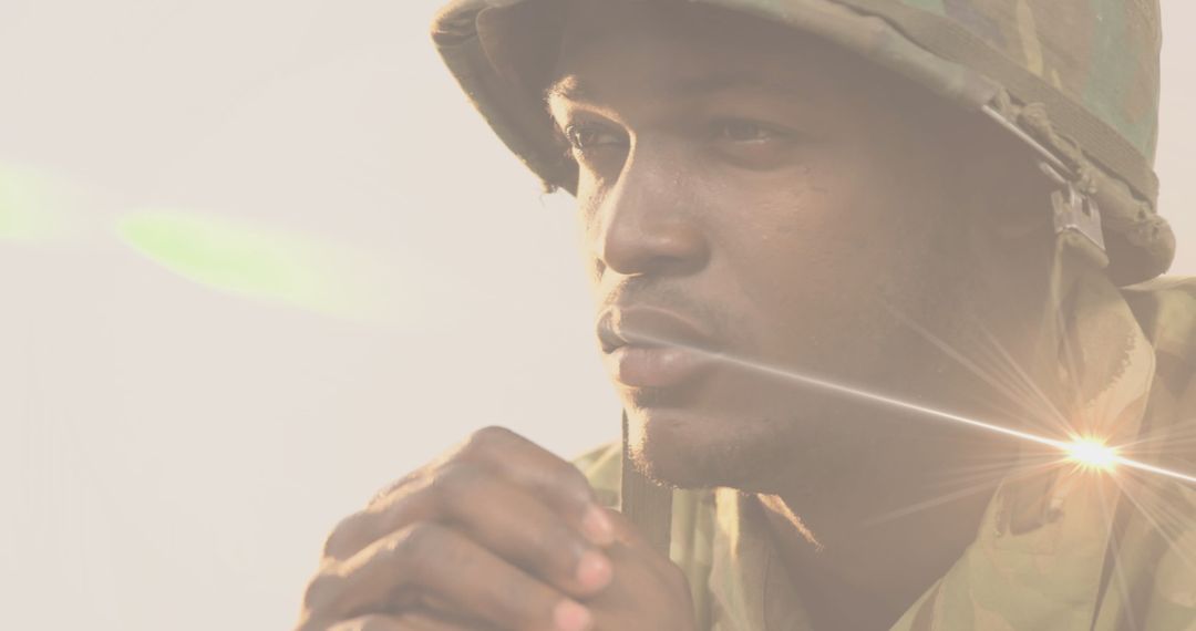 African-American Soldier Reflecting Amid Light Trails - Free Images, Stock Photos and Pictures on Pikwizard.com