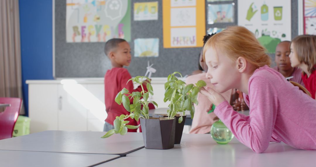 Redhead Elementary School Girl Smelling Plants in Classroom Science Activity