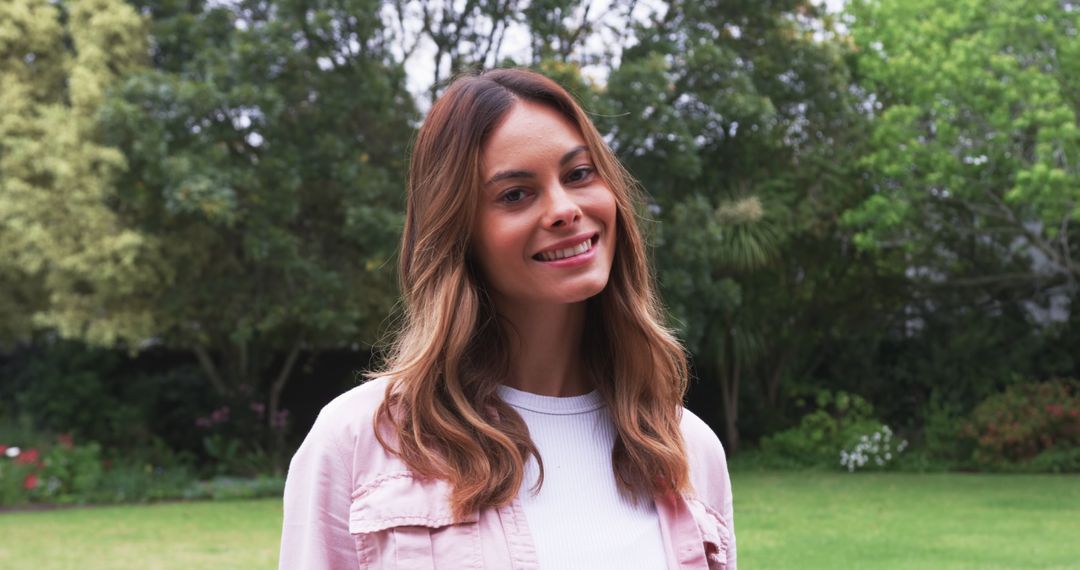 Smiling Woman Enjoying Peaceful Backyard Garden