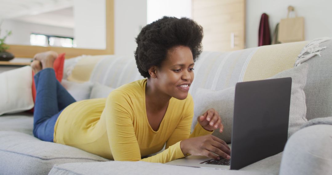 Smiling African American Woman Working on Laptop at Home - Free Images, Stock Photos and Pictures on Pikwizard.com