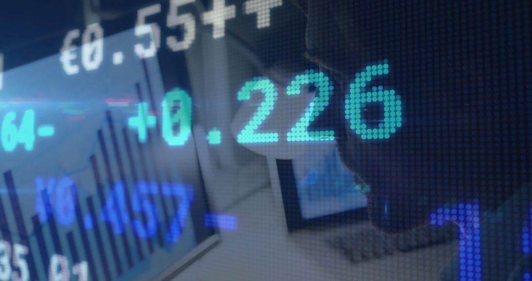 Businessman Analyzing Stock Market Data on Computer Screens
