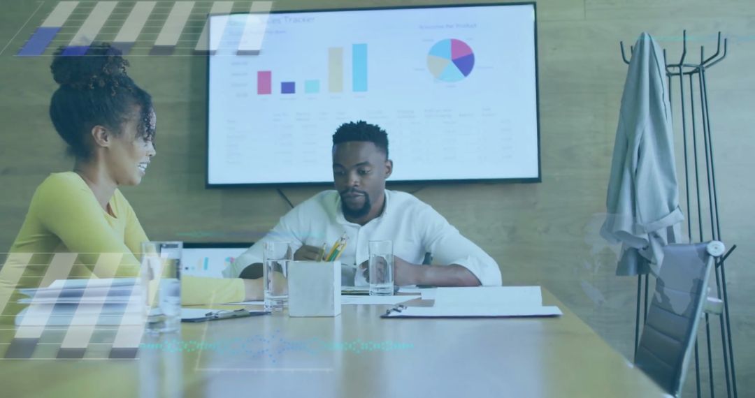 Collaborative Team Analyzing Financial Reports with Digital Graphics