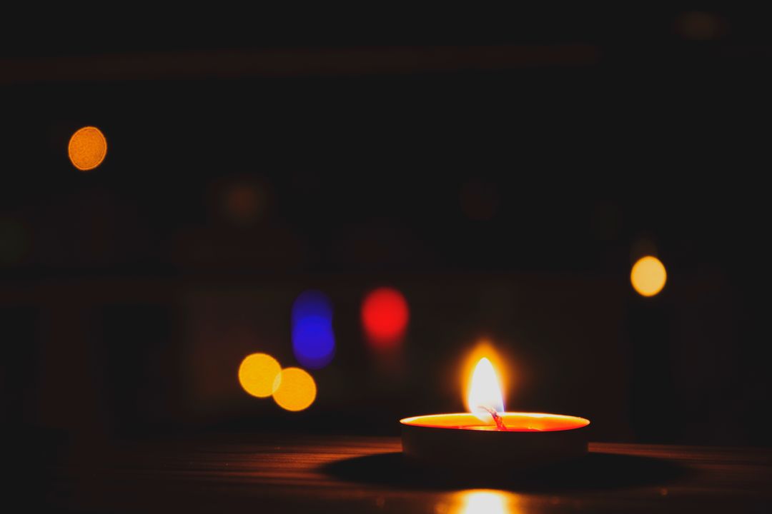 Cozy Candlelight with Soft Bokeh in Dark Background