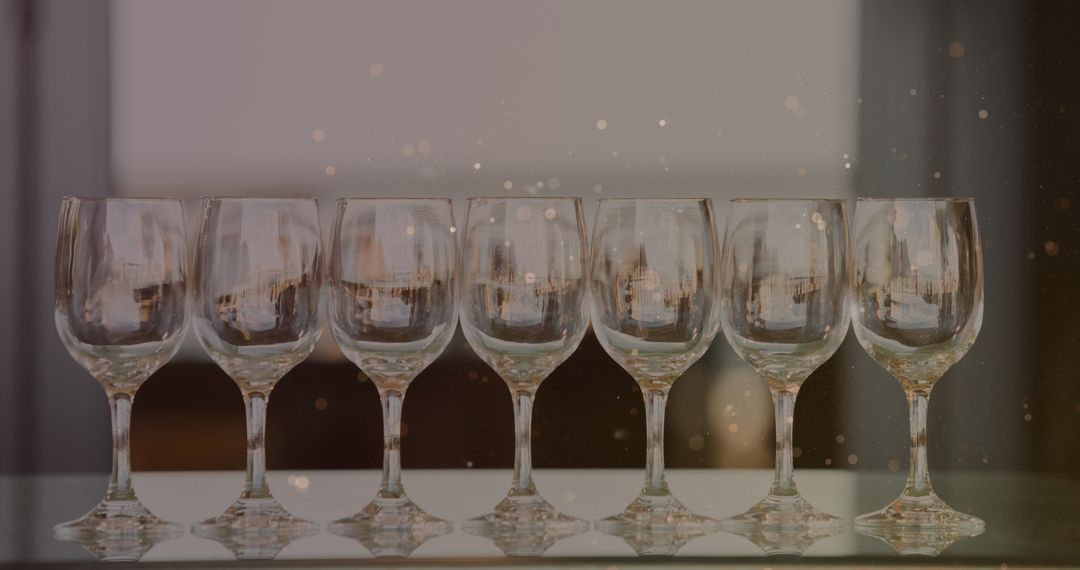 Elegant Wine Glasses Highlighted by Soft Golden Lights