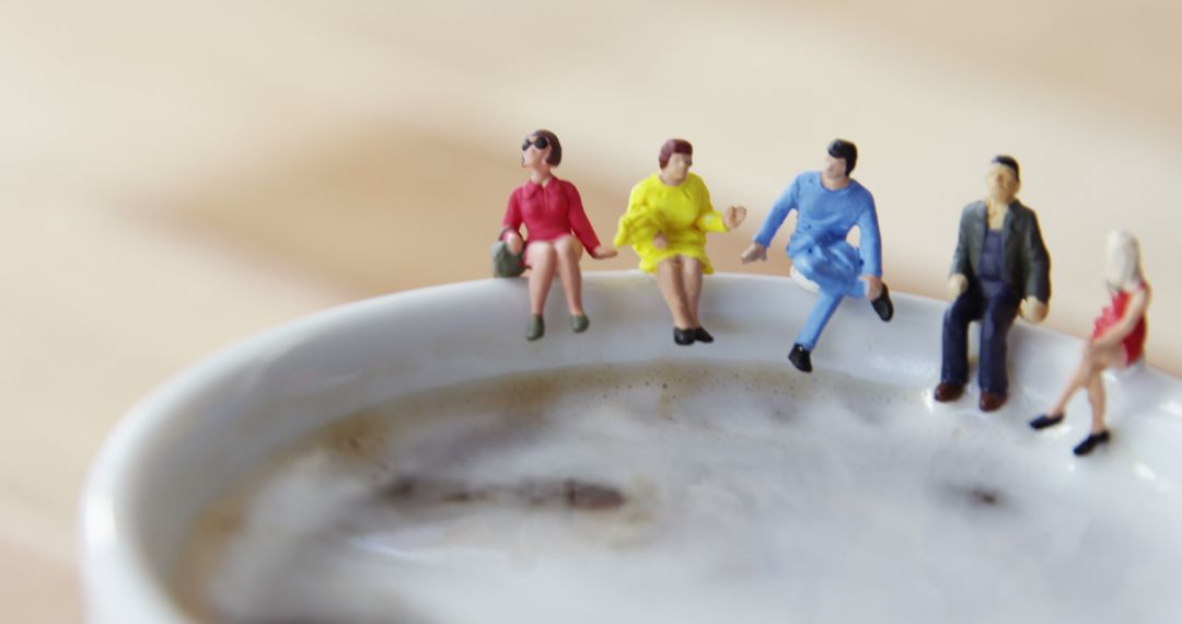 Miniature People Sitting on Coffee Cup Rim - Free Images, Stock Photos and Pictures on Pikwizard.com