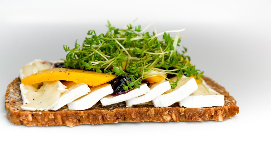 Open-Faced Sandwich with Brie, Mango, and Microgreens