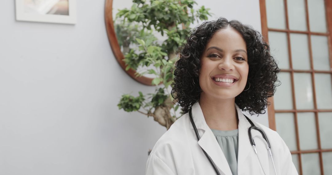 Smiling African American Female Doctor with Stethoscope - Free Images, Stock Photos and Pictures on Pikwizard.com