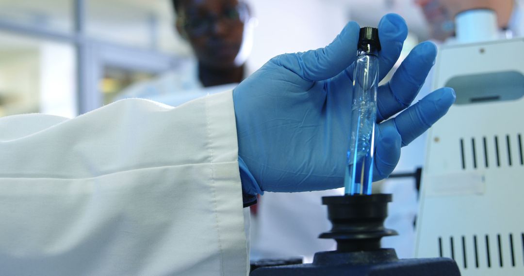 Scientist holding test tube in laboratory environment - Free Images, Stock Photos and Pictures on Pikwizard.com