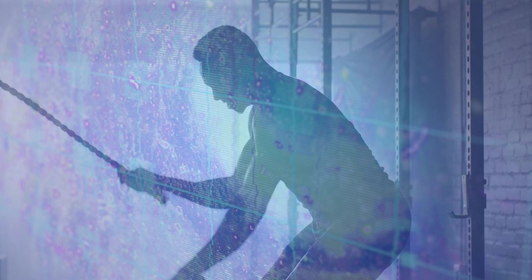 Man Exercising with Battle Ropes in Gym with Digital Energy Overlay