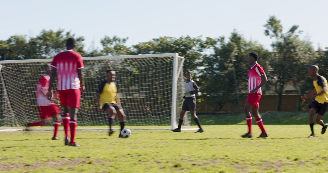 Intense Soccer Match with Diverse Players on Sunny Field