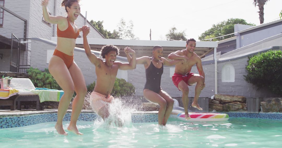 Joyful Friends Jumping into Swimming Pool Together