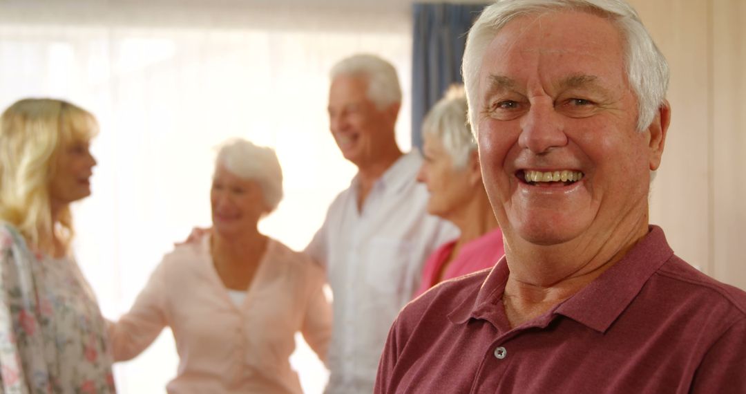 Smiling Elderly Man Enjoying Family Gathering - Free Images, Stock Photos and Pictures on Pikwizard.com