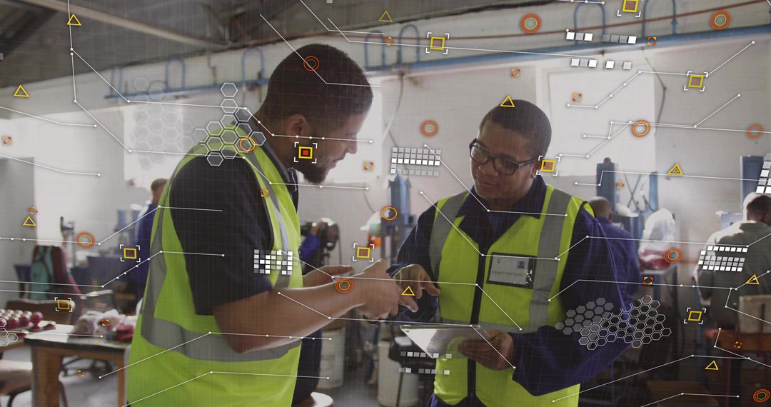 Industrial team reviewing tablet and pointing, collaborating with augmented data overlays
