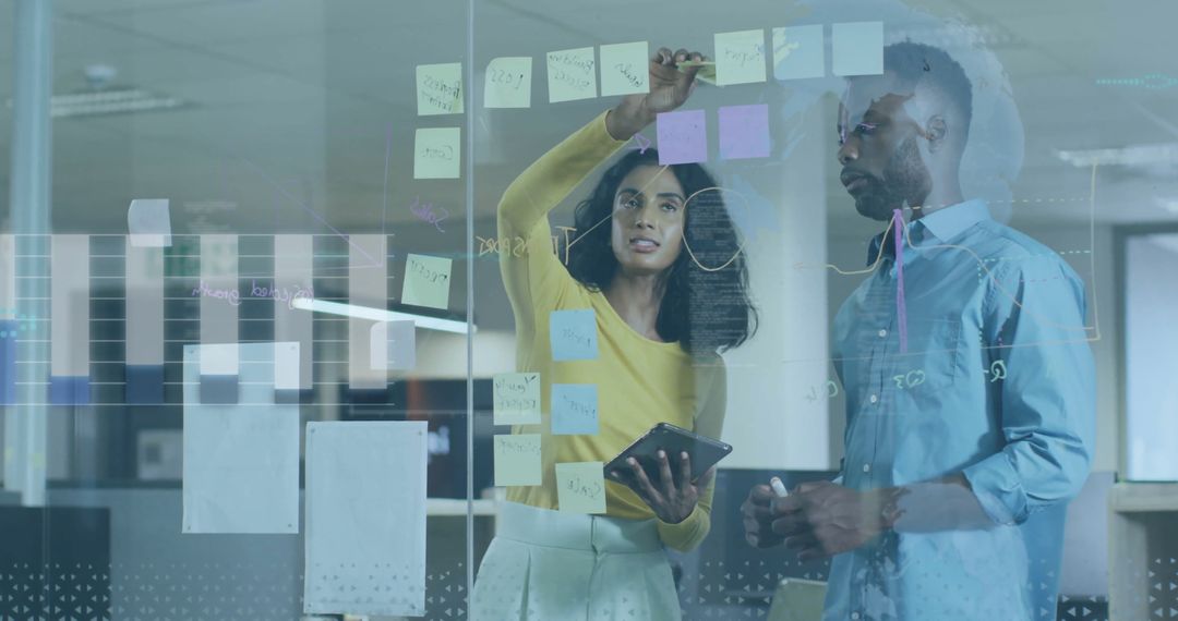 Professionals Collaborating on Business Ideas Using Sticky Notes and Tablet