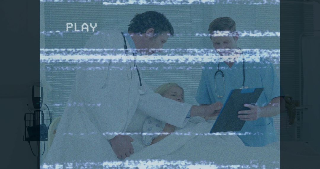 Doctors Consulting with Patient in Hospital Room