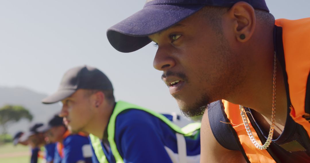 Diverse Team of Baseball Players Practicing on Field