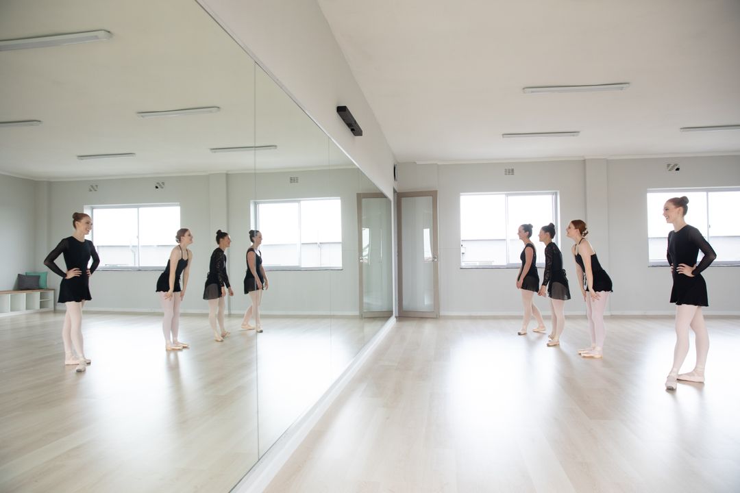Group of Ballet Dancers Practicing in Bright Studio - Free Images, Stock Photos and Pictures on Pikwizard.com