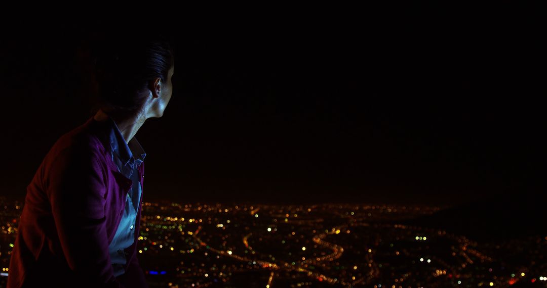 Person Gazing at City Lights at Night - Free Images, Stock Photos and Pictures on Pikwizard.com